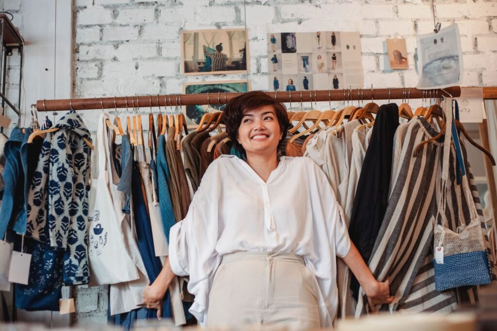 A small business owner standing in her shop, found by customers online